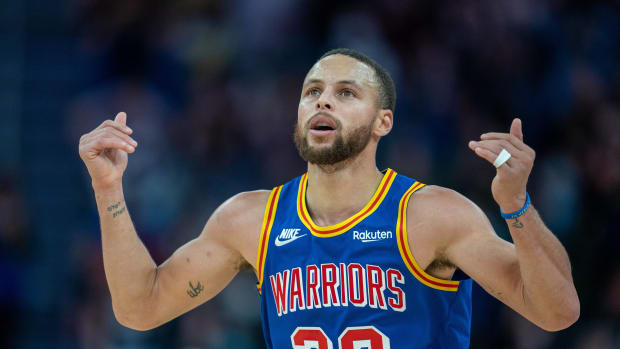 Stephen Curry celebrates a made shot.